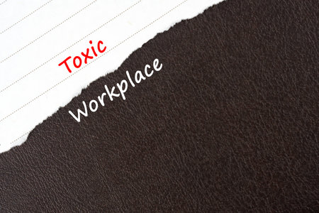 Torn paper with text toxic workplace, black and white backgroundの写真素材