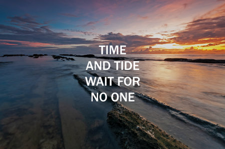 Sunset background with life inspirational quotes - Time and tide wait for no oneの写真素材