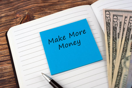 Make more money text on adhesive noteの写真素材