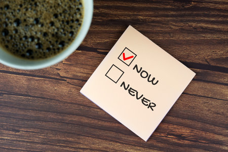 Now or Never text on adhesive noteの写真素材