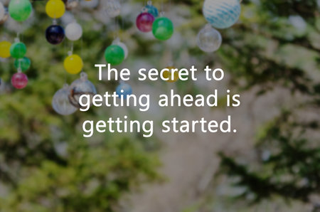 Blurry image with Inspirational quotes the secret of getting ahead is getting startedの写真素材