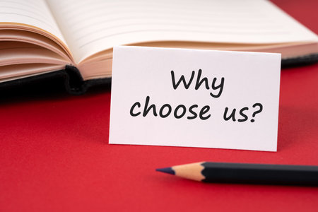 Why choose us text on a paper noteの写真素材