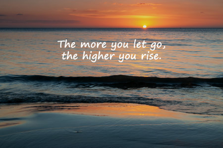 Sunset background with inspirational quotes the more you let go the higher you riseの写真素材