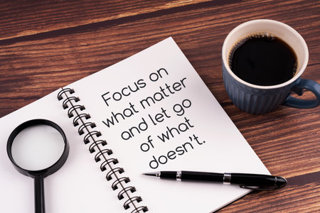 Notepad with inspirational quotes - focus on what matter and let go of what doesn'tの写真素材