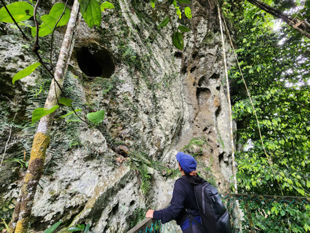 Woman looking at the ancient burial site of The Sugpan tribe in Danum Valley Lahad Datuの写真素材