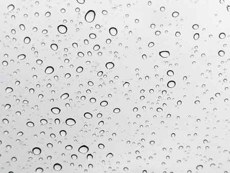Rain droplets on a glass backgroundの写真素材