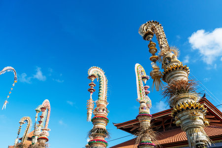 Balinese Penjor against blue sky Denpasar Baliの写真素材