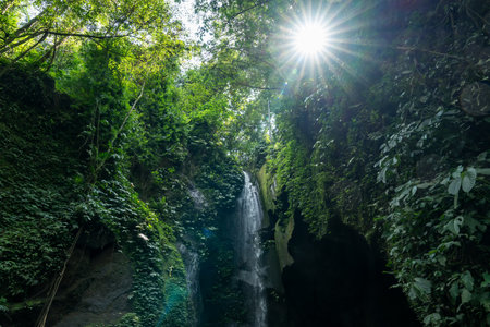 Sunburst at Pengempu waterfall located in desa Sangeh Bali Indonesia