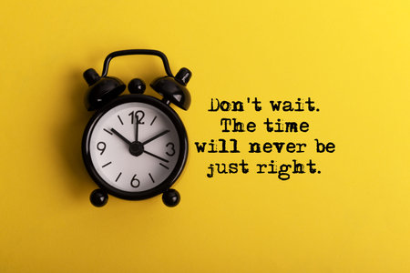 Alarm clock and inspirational quotes - Don't wait. The time will never be just right. Yellow...