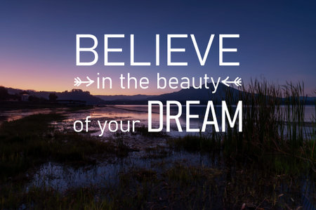 Sunset background with inspirational quotes believe in t he beauty of your dreamの写真素材