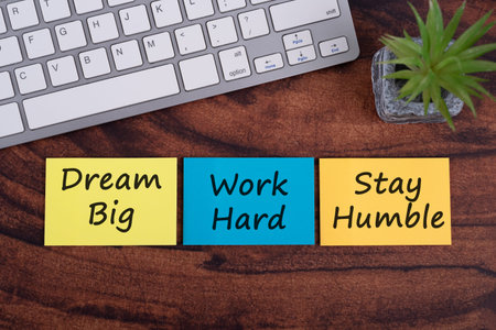 Dream big, work hard, stay humble inspiration quotes on colorful paper note
