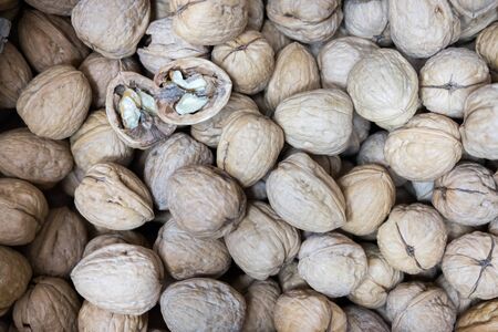 Unpeeled english walnuts  sold at local city marketの写真素材