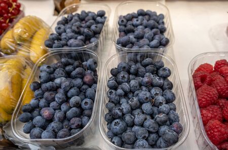 blueberries and raspberries for sale at the Bolzano market. Italyの写真素材