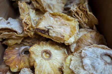 dried pineapple slices sold at local city marketの写真素材
