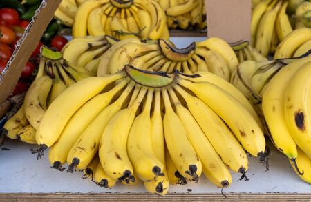 fresh bananas for sale at local farmers marketの写真素材