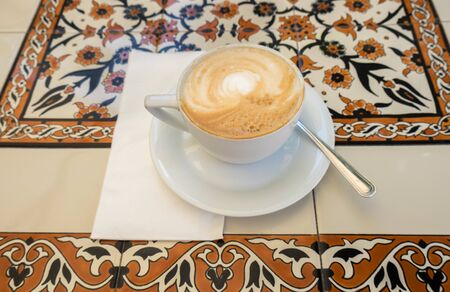 Cappuccino coffee on tableの写真素材