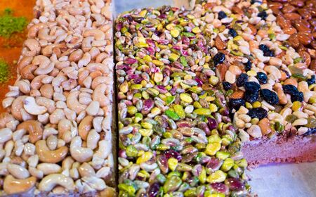 Arabic sweet cakes with nuts (cashew, pistachio, almonds, raisins, etc)の写真素材