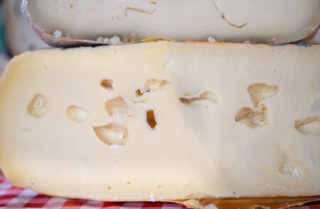 Dutch cheese with holes sold at farmers marketの写真素材