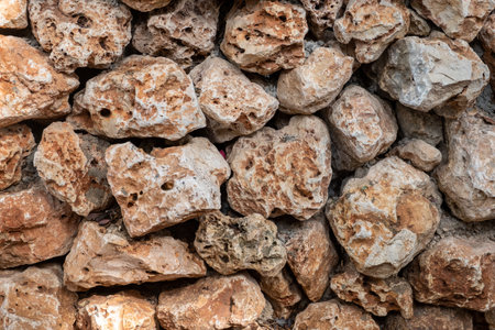 The wild stones decorative wall. Natural limestone background or surfaceの写真素材