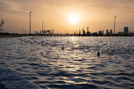 Fountain at amazing sunset time. Beer Sheva River Park. Israelの写真素材