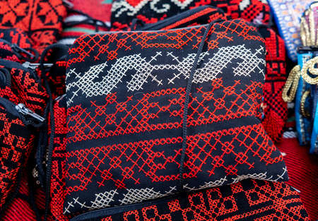 Embroidered little bags or wallets for sale at an outdoor market.の写真素材