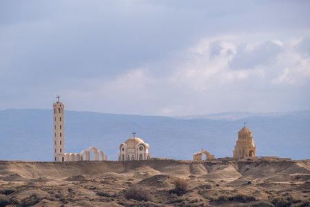 View from Israel on monasteries and churches on the Jordanian part at the Qasr al-Yahud baptism site on the Jordan Riverの写真素材