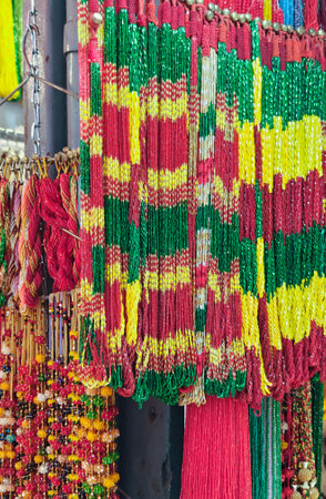 Large choice of handmade strands of colorful beads at an outdoor market in Kathmandu, Nepalの写真素材