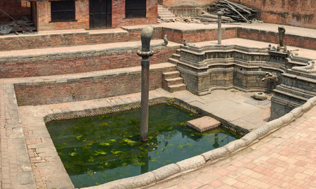 The bronze cobra statue at a temple at Patan Durbar Square, a historical site in Lalitpur district. Nepalの写真素材