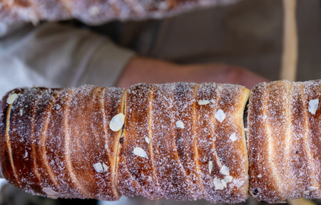 Sweet chimney cake - Trdelnik or Kurtos Kalacs sell at Christmas market in Prague, Czech Republicの写真素材