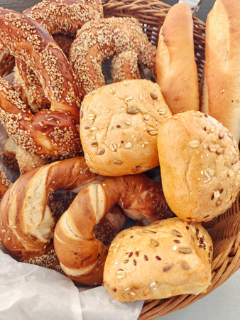 Sesame buns, bagels, and other breads on small cafe standの写真素材