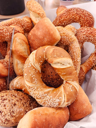 Sesame buns, bagels, and other breads on small cafe standの写真素材
