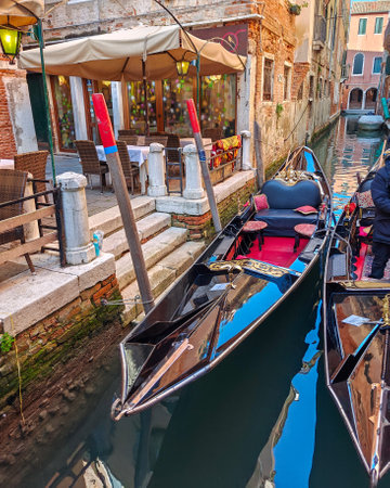 The gondolas are on the narrow canal in Venice. Italyの写真素材