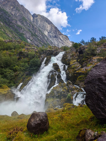 Amazing waterfall Kleivafossen fed by Briksdal Glacier.  Olden, Vestland, Norwayの写真素材
