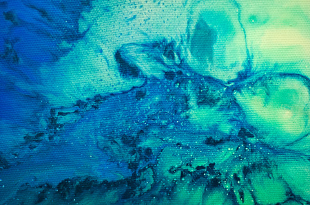 Traditional turkish ebru art technique, abstract colored acrylic paint spots on water or canvas for background or wallpaperの写真素材