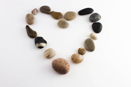 Small stones shaping a heart symbolizing loveの写真素材
