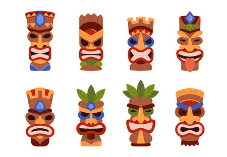 Tiki mask vector icons set, Hawaiian tribal wooden carved totem, idol scary face with toothy mouth decorated with leavesのイラスト素材