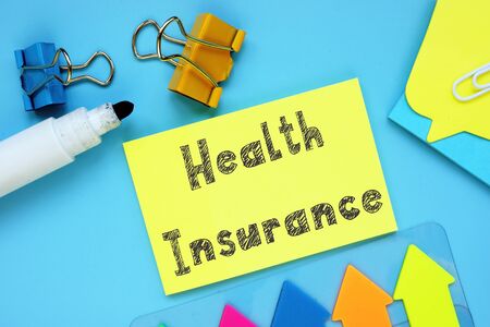 Financial concept about Health Insurance with inscription on the piece of paper.の写真素材
