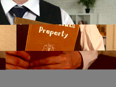 Business concept meaning Intellectual property with sign on the page.の写真素材