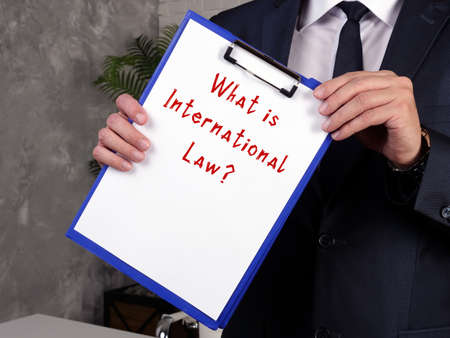 Juridical concept meaning International Law? with inscription on the piece of paper.の写真素材