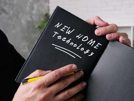 Financial concept meaning NEW HOME Technology with sign on the page.