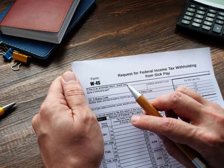 Form W-4S Request for Federal Income Tax Withholding from Sick Pay sign on the sheet.