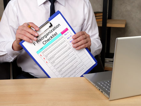 Business concept meaning F Reorganization Checklist with inscription on the sheet.の写真素材