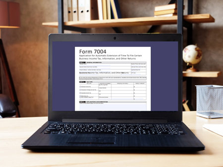 Business concept about  Form 7004 Application for Automatic Extension of Time To File Certain Business Income Tax, Information, and Other Returns  with phrase on the piece of paper.の写真素材