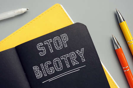Conceptual photo about STOP BIGOTRY with handwritten text. The Stop Bigotry meme likely works well as fundraiser, which is its function.の写真素材