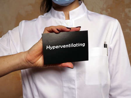 Medical concept meaning Hyperventilating with inscription on the piece of paper.