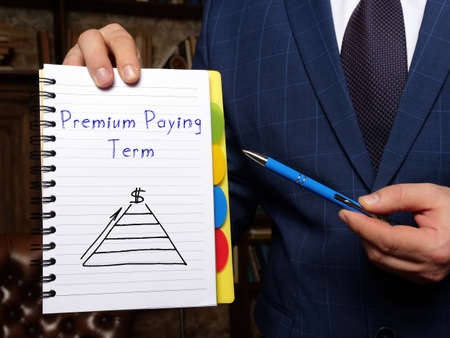 Premium Paying Term inscription on the white notepad.