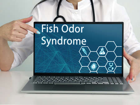Fish Odor Syndrome text in menu. Neurologist looking for something at laptop