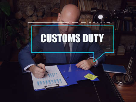 CUSTOMS DUTY text in footnote block. Budget analyst checking financial report Customs Duty is a tax...