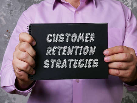 CUSTOMER RETENTION STRATEGIES inscription on the sheet.の写真素材