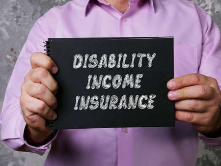 Financial concept about DISABILITY INCOME INSURANCE with phrase on the page.の写真素材